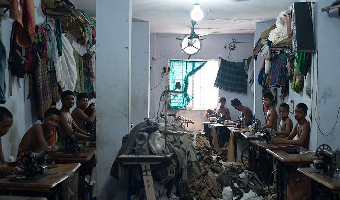 In Bangladesh, the children  work for 20p a day to produce clothes for the West PHOTOS